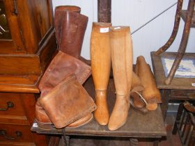 Two pairs of leather boots, together with wooden b