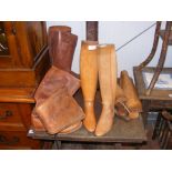 Two pairs of leather boots, together with wooden b