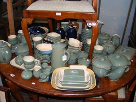 A large quantity of Denby in green and blue glazes
