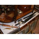 Assorted swords, daggers and swagger sticks