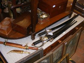 Assorted swords, daggers and swagger sticks