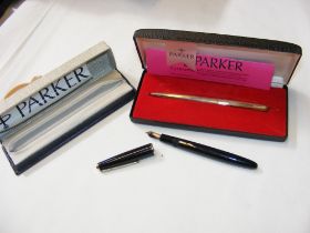 A boxed Parker pen set and one other