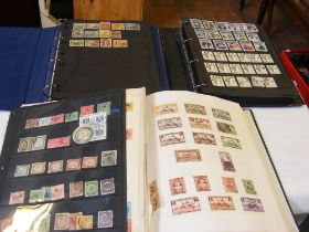 Three albums of Middle Eastern stamps including Eg