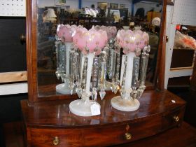 A pair of pink and opaque glass lustres with drops