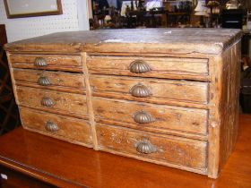 A miniature pine chest of eight drawers - width 60