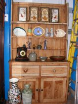 A pine dresser, rack to back, drawers and cupboard