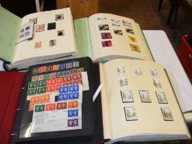 Four albums of GB stamps
