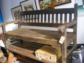 A three seater teak garden bench