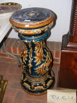 A Victorian Majolica jardiniere stand with impress