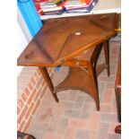 An antique envelope games table with single drawer