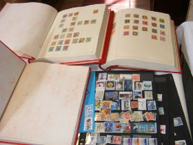 Worldwide stamps in two old Ideal stamp albums