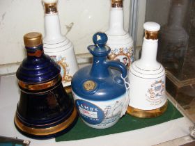 Four unopened Bells Scotch Whisky decanters, toget