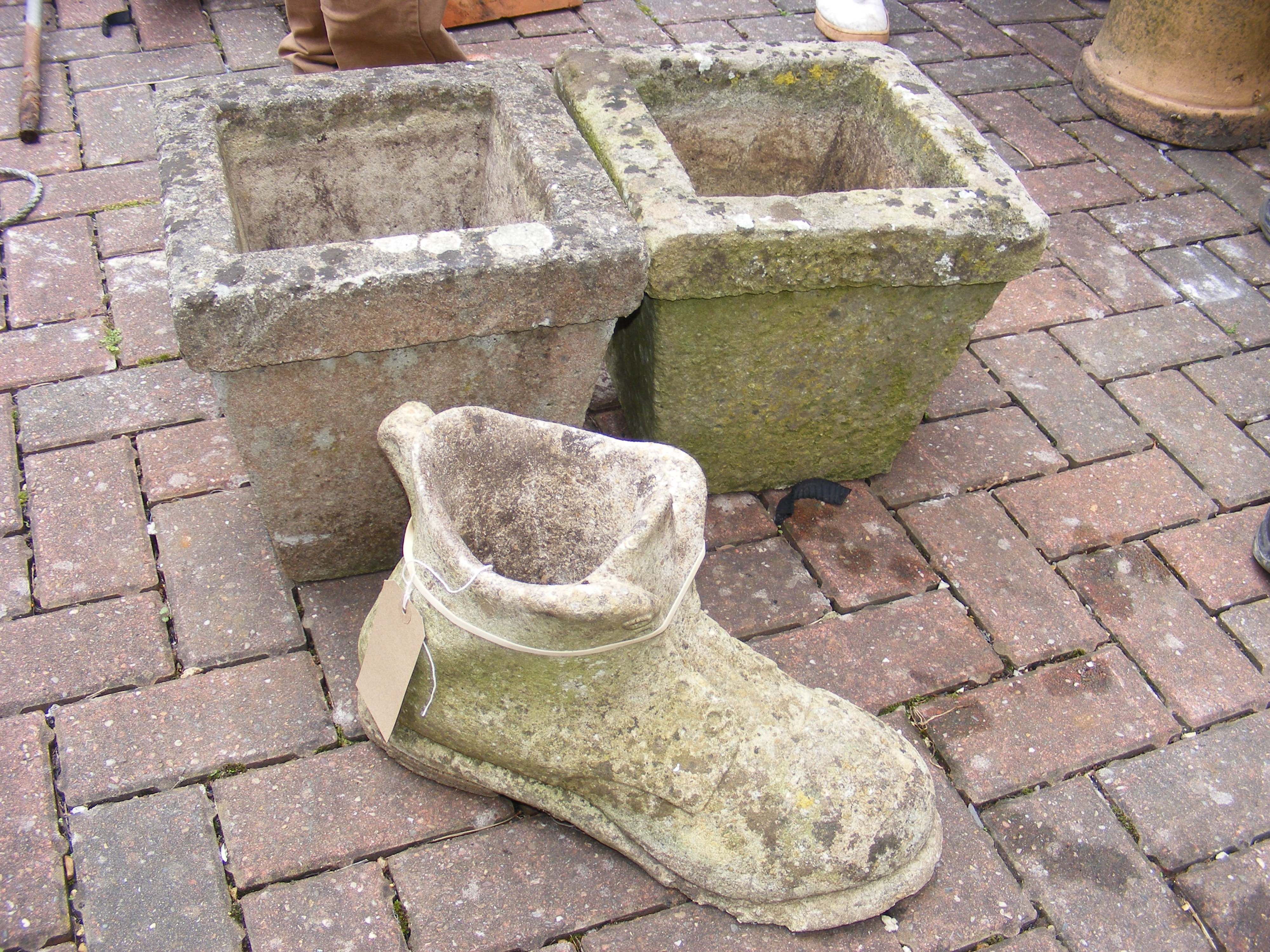 Two square garden planters and an ornamental boot