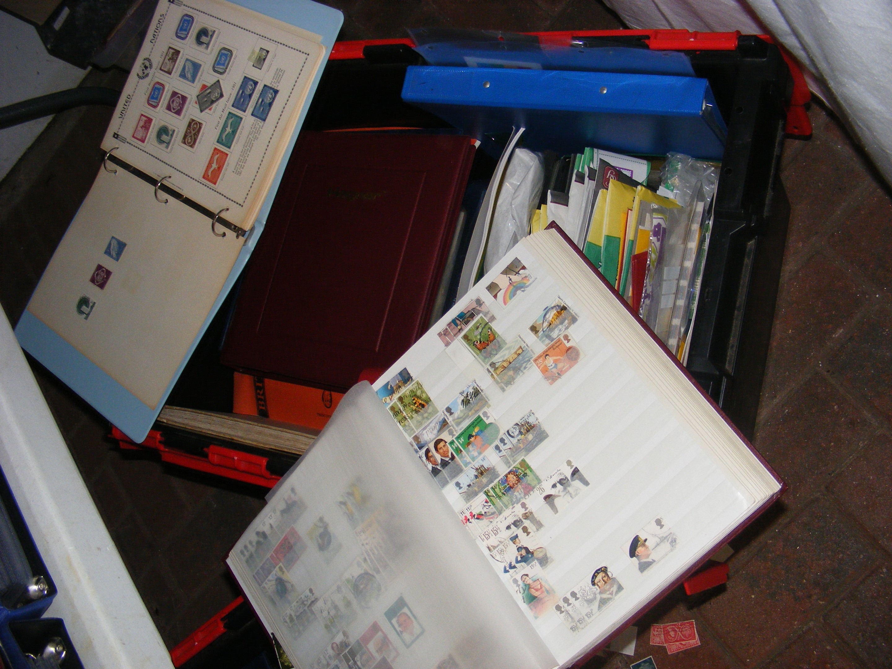 A box of stamps and philatelic accessories