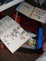 A box of stamps and philatelic accessories
