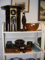 Two shelves of sundry treen and an octagonal foldi