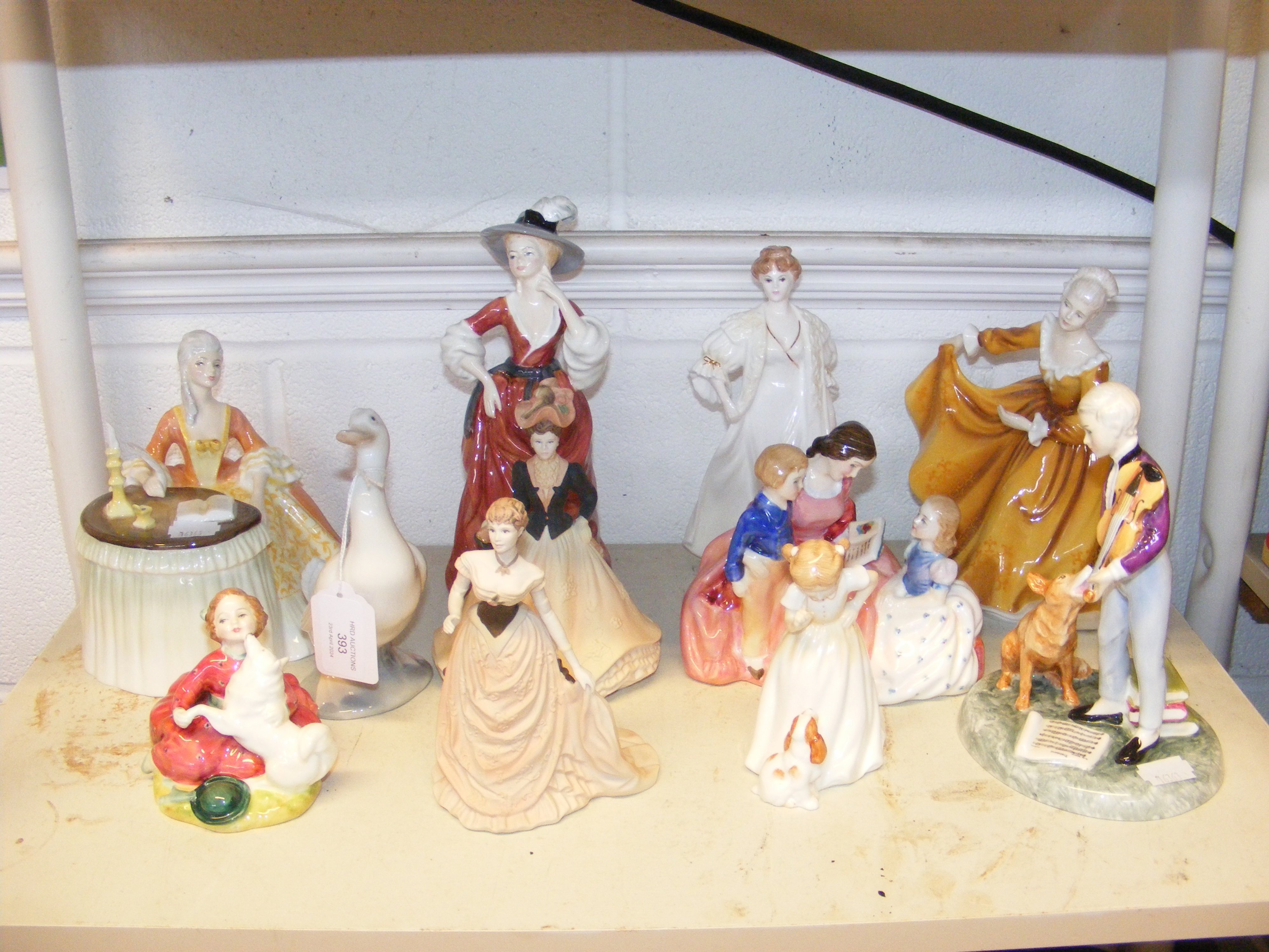 A collection of Royal Doulton ornaments, including