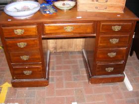 A Victorian walnut pedestal desk with nine drawers