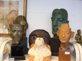 A sculpted head on plinth, together with other orn