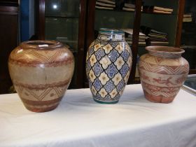 Two vintage decorated terracotta vases together wi