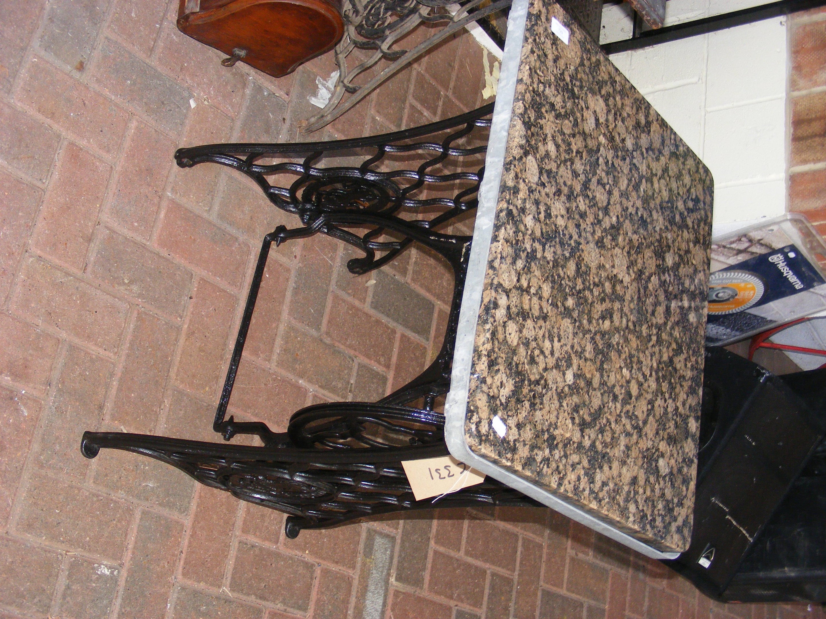 A converted sewing machine table with marble top