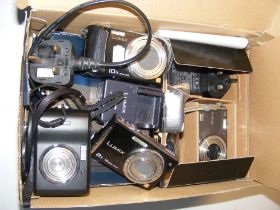 A quantity of old digital cameras and accessories