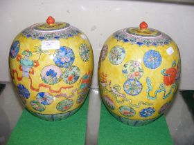A pair of antique Chinese vases with yellow ground