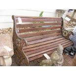 A slatted garden bench with cast iron ends - lengt