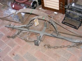 An antique wrought iron mantrap, together with one