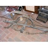 An antique wrought iron mantrap, together with one