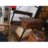 An unusual double seated school desk with lift up