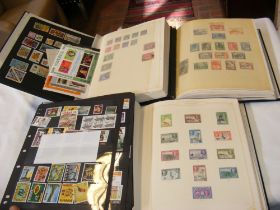 Three albums of African stamps