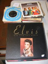 A collection of Elvis Presley vinyl LP and single