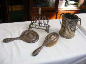 A silver backed mirror and brush, plated toast rac