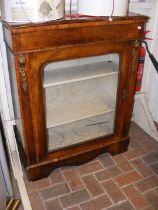 A Victorian walnut pier cabinet with gilt beading