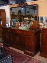 A Victorian mahogany serpentine fronted sideboard