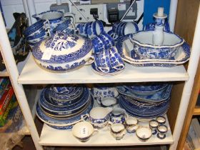 Assorted blue and white ware on two shelves