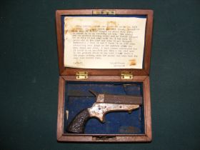 A miniature antique pocket pistol with some histor