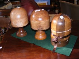 Three vintage wooden hat blocks