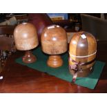 Three vintage wooden hat blocks