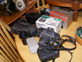 Assorted vintage photography equipment, including