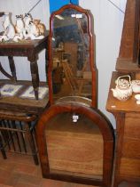 Two antique wall mirrors of varying shape and size