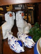 A pair of Staffordshire mantel dogs, a pair of Chi
