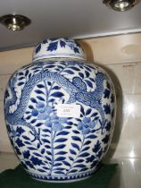 An antique Chinese ginger jar and cover with blue