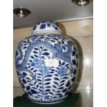 An antique Chinese ginger jar and cover with blue