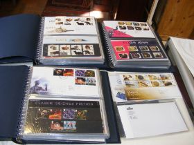 Three blue albums containing First Day Covers and