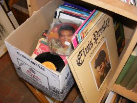 A selection of Elvis vinyl LP and single records,