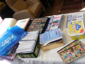 An assorted collection of stamps, catalogues etc.