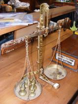 A set of antique brass balance scales, together wi