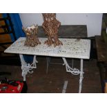A pierced cast iron garden table, together with a